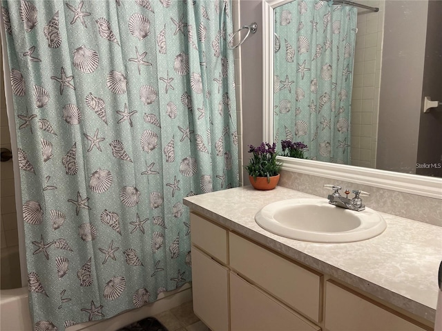 bathroom featuring vanity, tile patterned flooring, and shower / bath combo with shower curtain