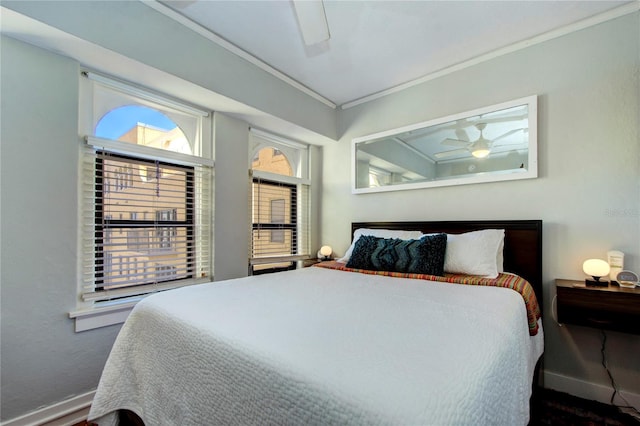 bedroom featuring ceiling fan and crown molding