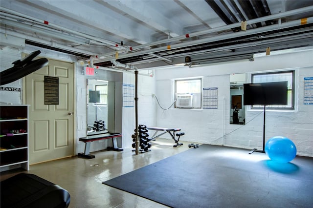 workout area featuring concrete flooring