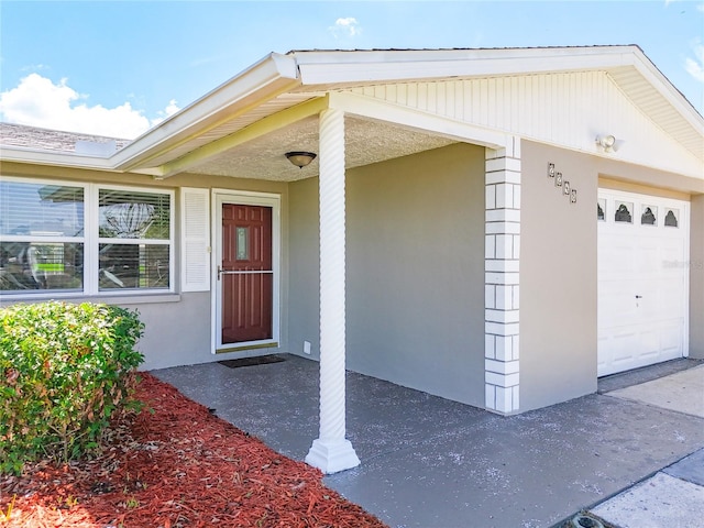 entrance to property featuring a garage