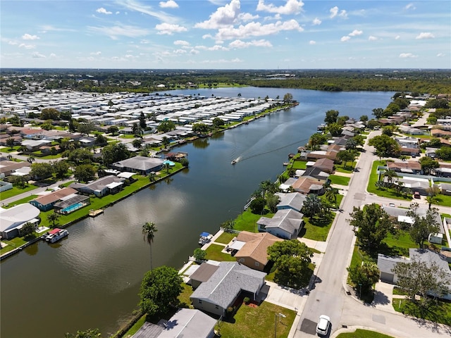 drone / aerial view with a residential view and a water view