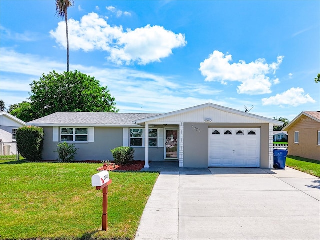 single story home with a front yard and a garage