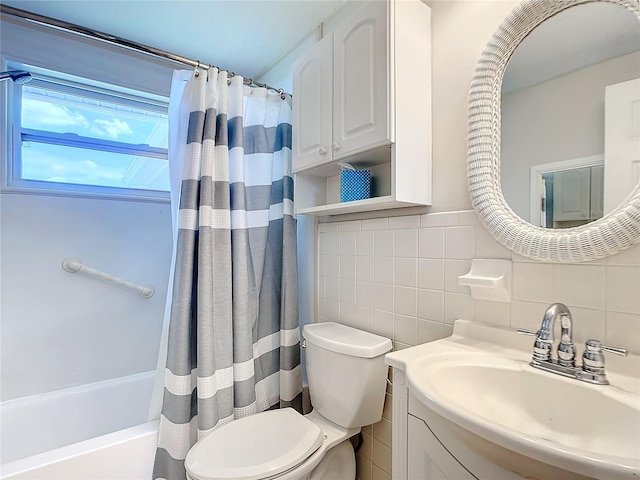 full bathroom featuring shower / tub combo with curtain, vanity, tile walls, and toilet