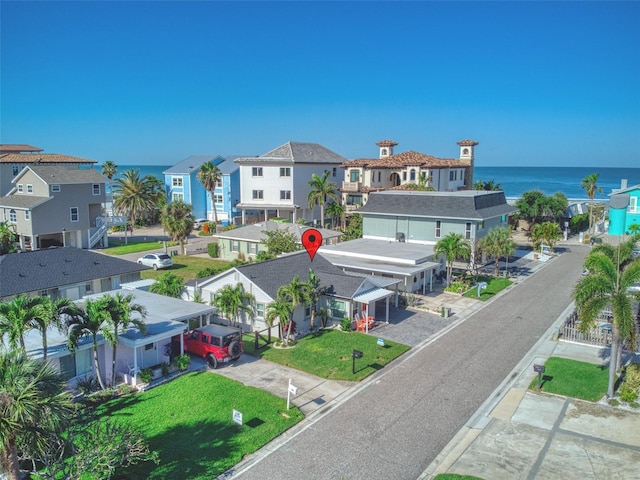 bird's eye view featuring a residential view and a water view