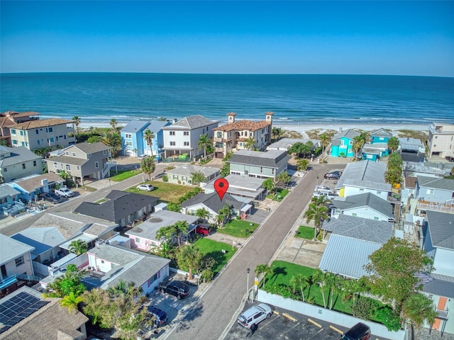 drone / aerial view featuring a residential view and a water view