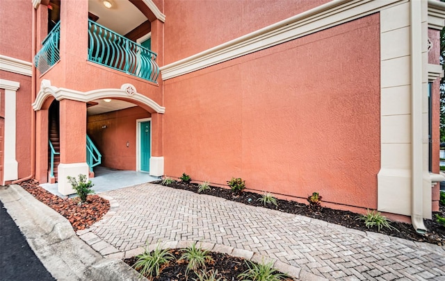 entrance to property with a balcony