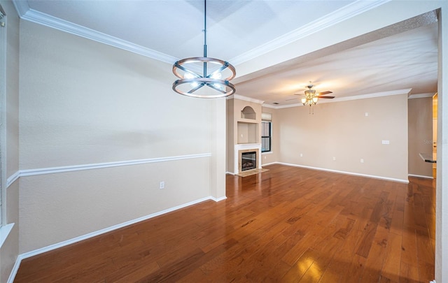 unfurnished living room with crown molding, wood-type flooring, and ceiling fan with notable chandelier