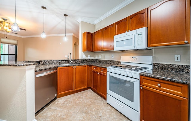 kitchen featuring white appliances, dark stone countertops, and decorative light fixtures