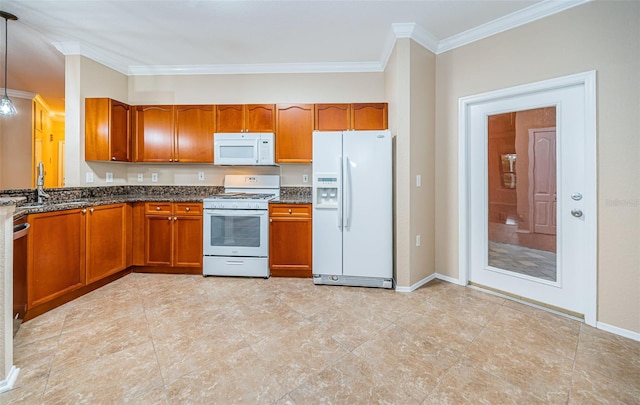 kitchen featuring dark stone countertops, ornamental molding, sink, decorative light fixtures, and white appliances