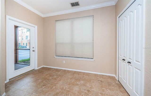 unfurnished room with crown molding