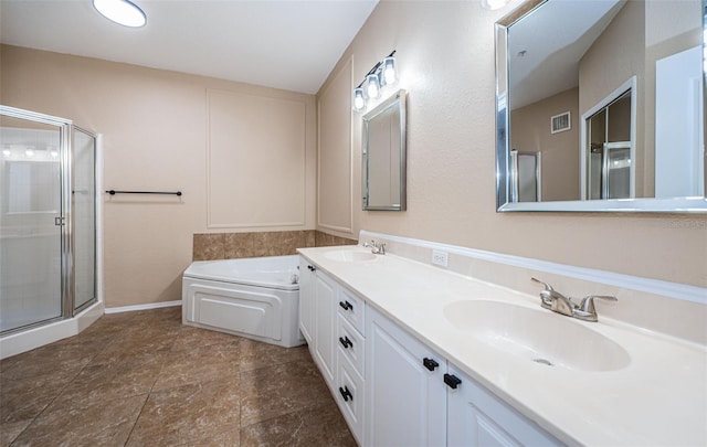 bathroom with vanity and independent shower and bath