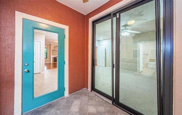 entryway with ceiling fan