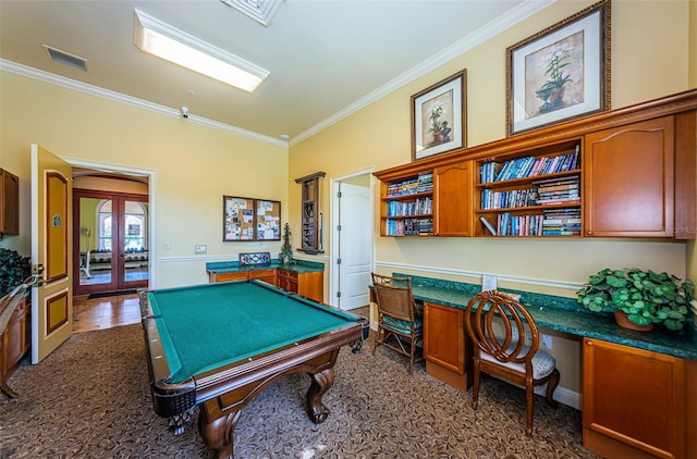 recreation room featuring french doors, ornamental molding, and built in desk