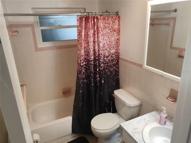 full bathroom with tile walls, vanity, shower / bath combination with curtain, and toilet