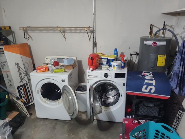 laundry area with water heater and washing machine and dryer