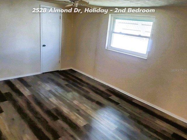 unfurnished room featuring dark hardwood / wood-style floors