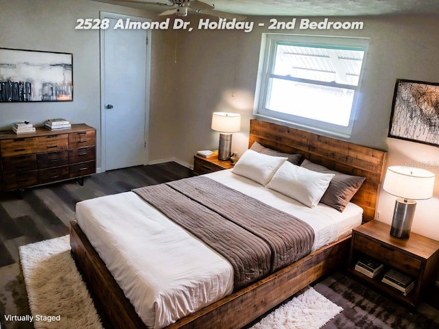 bedroom featuring dark hardwood / wood-style flooring