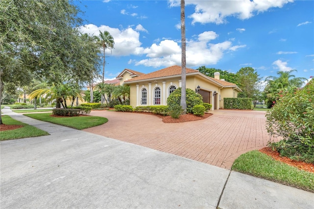 view of front of property with a garage