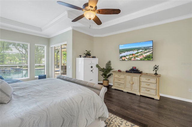 bedroom featuring ornamental molding, access to outside, ceiling fan, a tray ceiling, and hardwood / wood-style flooring