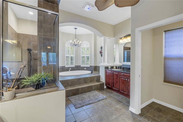 bathroom featuring tile patterned flooring, ceiling fan with notable chandelier, shower with separate bathtub, decorative columns, and vanity