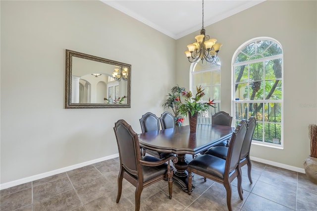 tiled dining room featuring crown molding, a notable chandelier, and a healthy amount of sunlight