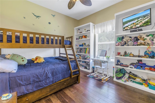 bedroom with ceiling fan and dark hardwood / wood-style flooring