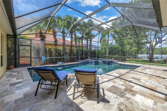 view of pool with a lanai and a patio area