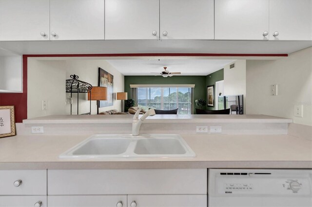 kitchen featuring dishwasher, white cabinetry, and sink