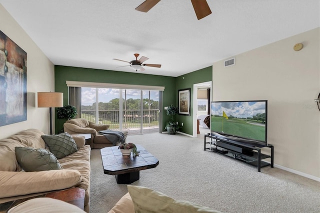 carpeted living room featuring ceiling fan