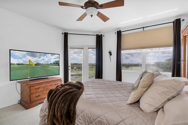 carpeted bedroom with access to exterior and ceiling fan