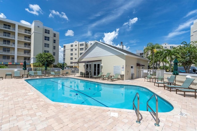 view of swimming pool with a patio