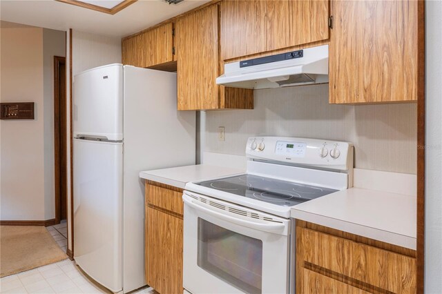 kitchen featuring white appliances and light tile patterned floors