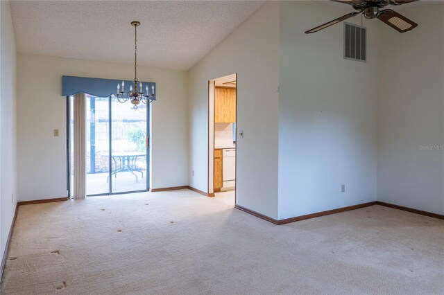 carpeted empty room featuring a textured ceiling, ceiling fan with notable chandelier, and lofted ceiling