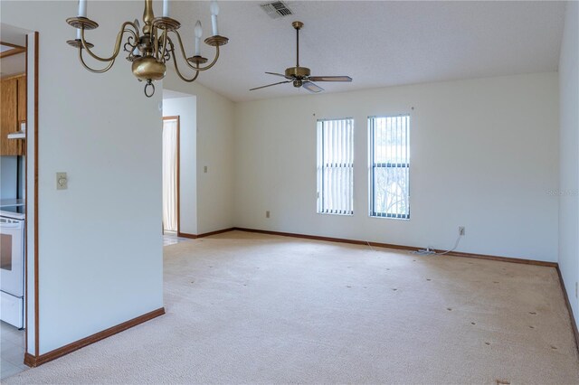 empty room with ceiling fan with notable chandelier