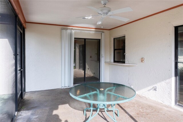 view of patio featuring ceiling fan