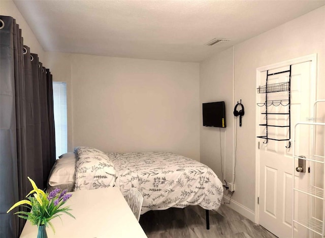 bedroom featuring wood-type flooring