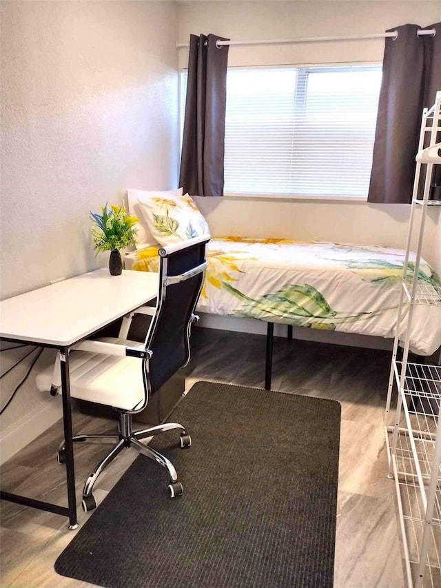 bedroom with wood-type flooring