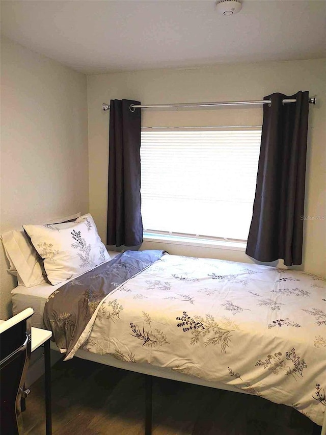 bedroom featuring wood-type flooring