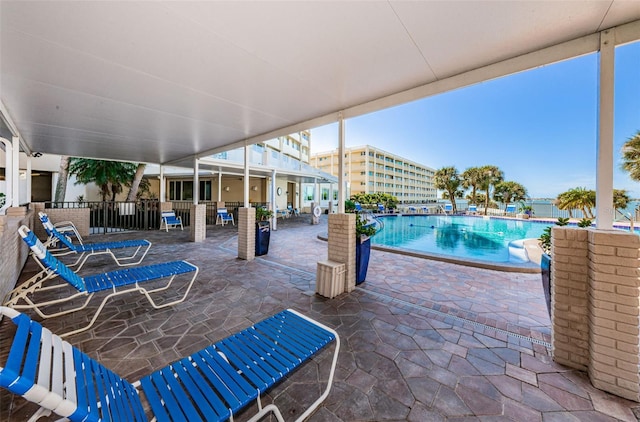 100 Bluff View Dr Unit 405C, Belleair Bluffs, FL 33770 - view of patio featuring a community pool