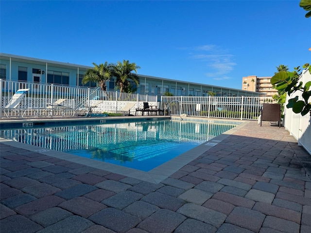 view of pool featuring a patio area