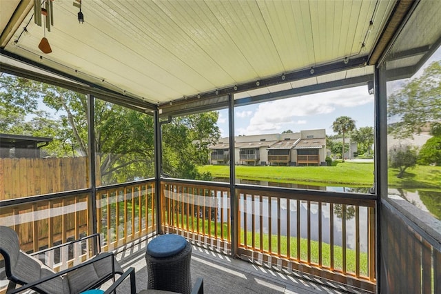 wooden deck with a water view