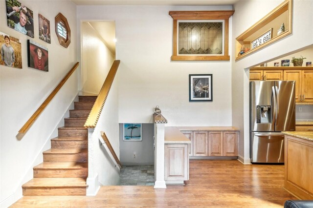 stairs with wood finished floors