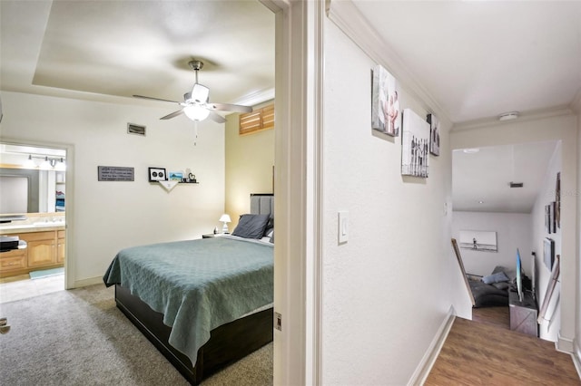 bedroom featuring ornamental molding, visible vents, connected bathroom, and baseboards