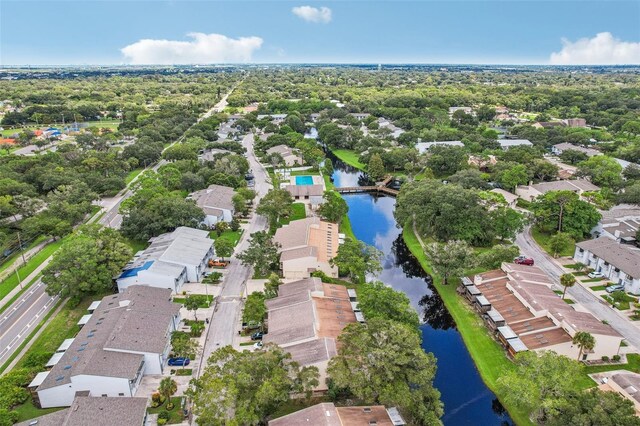 birds eye view of property featuring a water view and a residential view