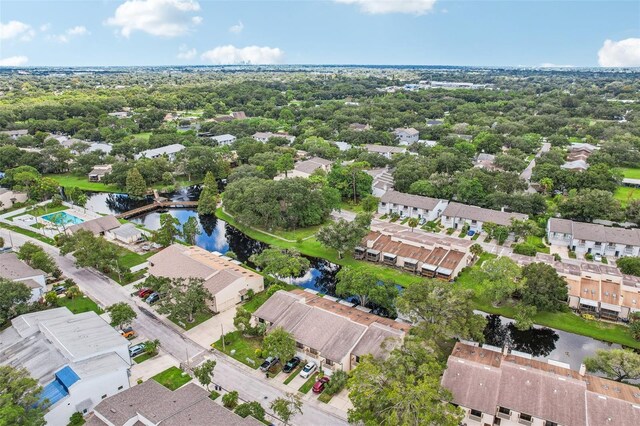 birds eye view of property featuring a residential view and a water view