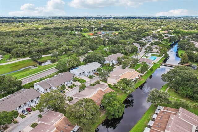 drone / aerial view with a water view and a residential view