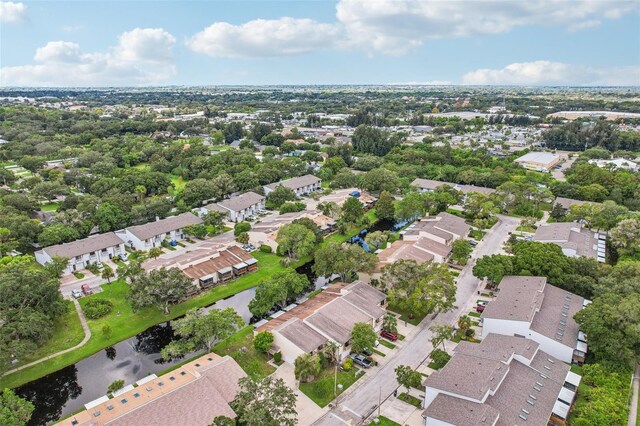 bird's eye view featuring a residential view and a water view