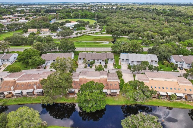 drone / aerial view featuring a water view and a residential view