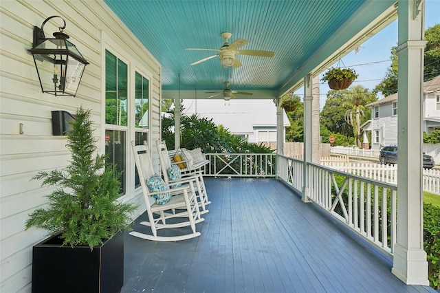 deck with covered porch and ceiling fan