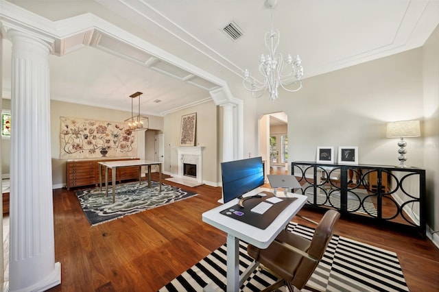 home office with dark hardwood / wood-style floors, ornamental molding, a high end fireplace, and decorative columns